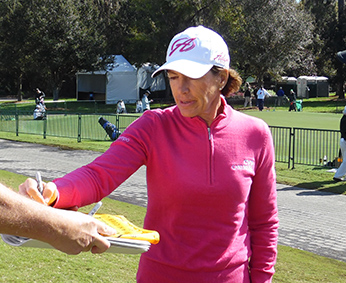 Tour players take the time to meet with fans and sign autographs.