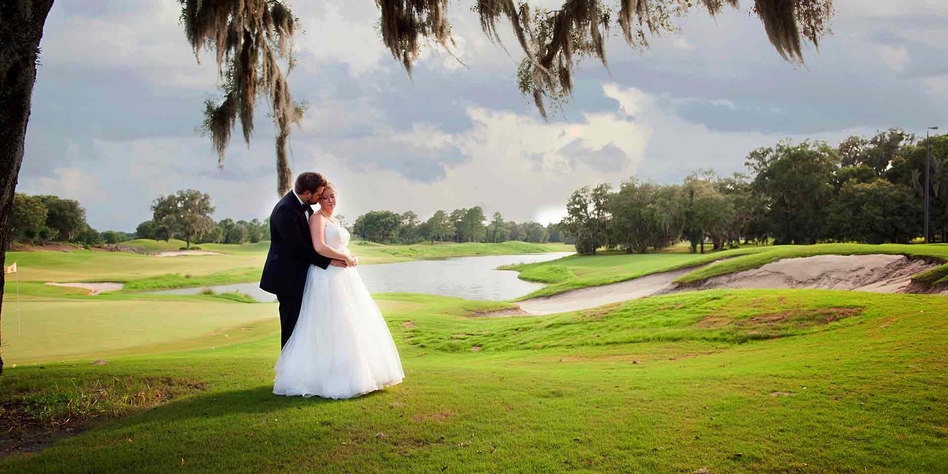 bride and groom on a golf course