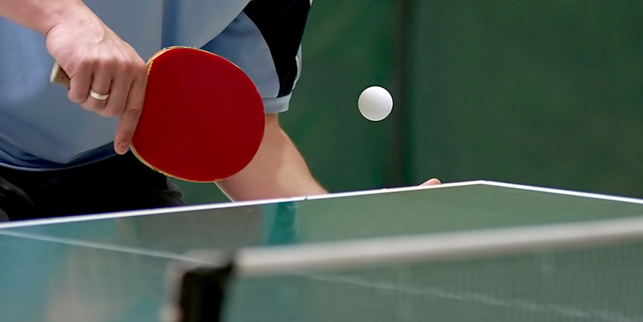 person playing table tennis