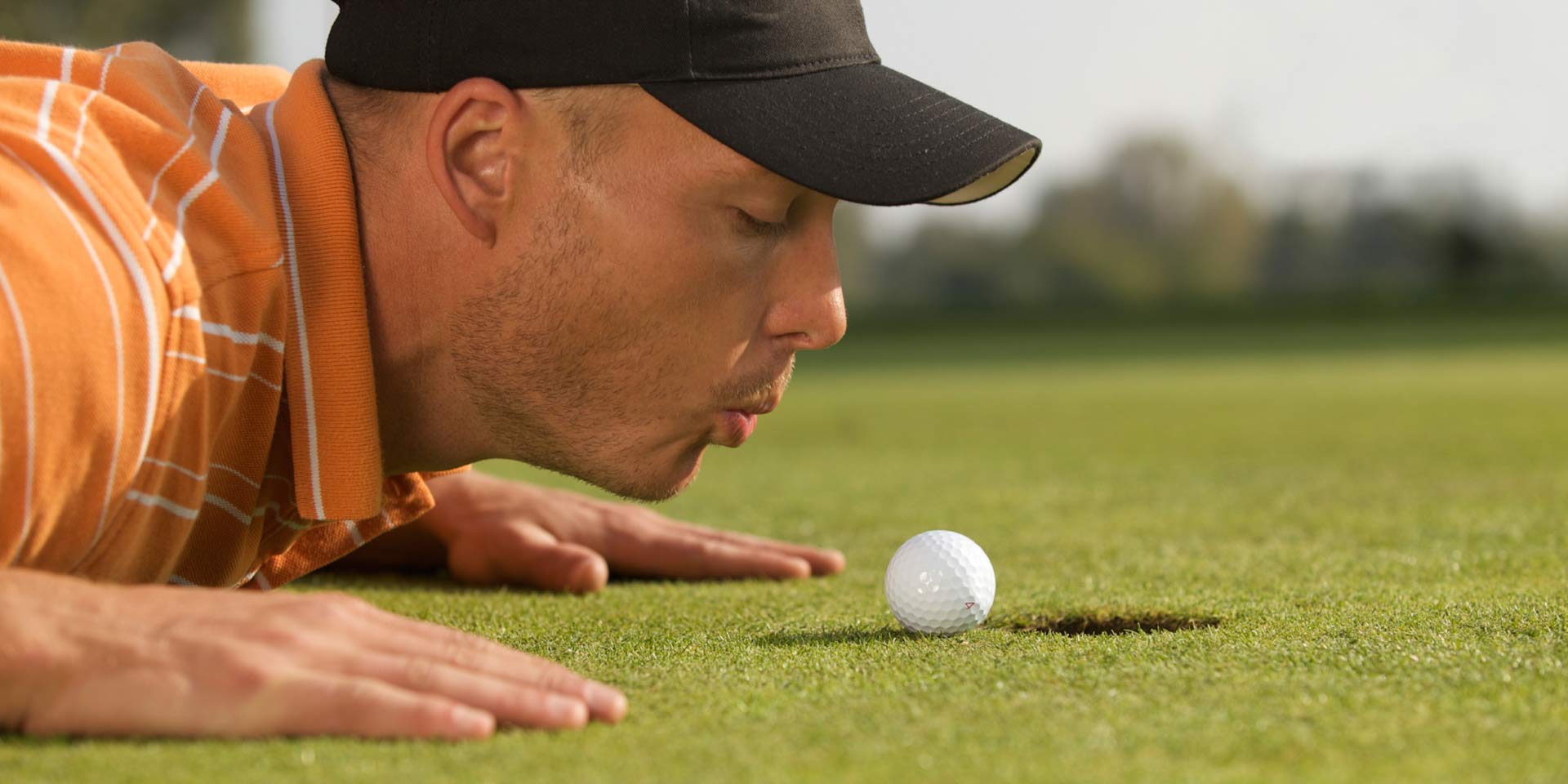 Man putting a golf ball