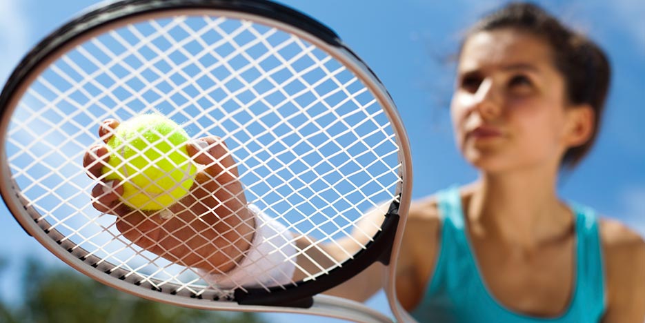 woman preparing to play tennis in Ocala.