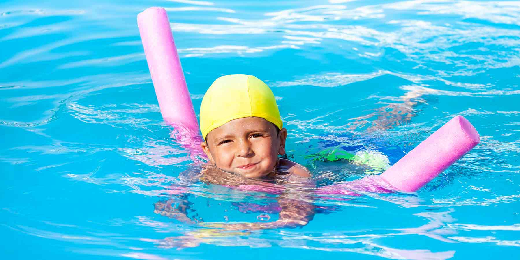 child taking swimming lessons in a pool