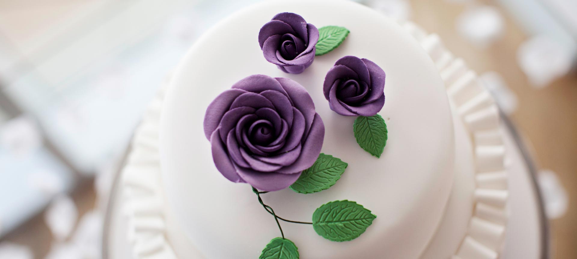 wedding cake with purple flower