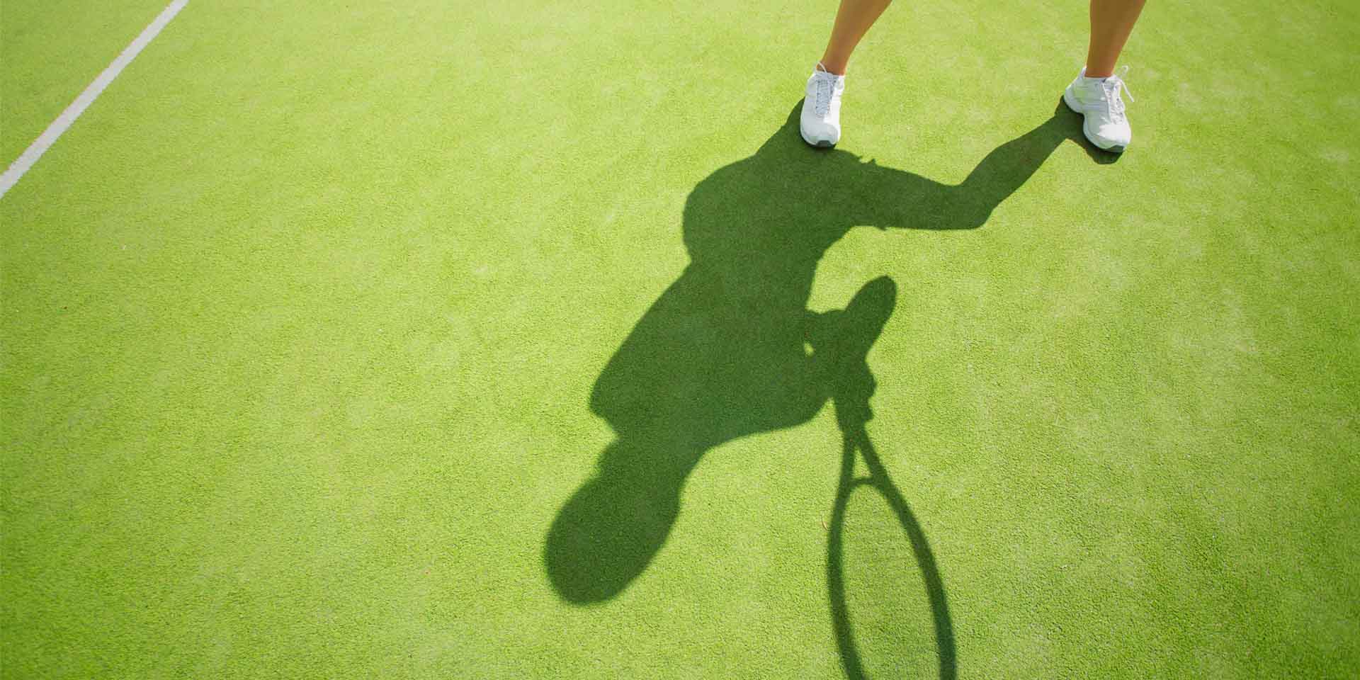 Tennis player's shadow.