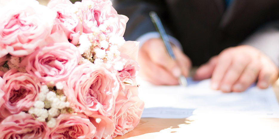 Signing a marriage license.