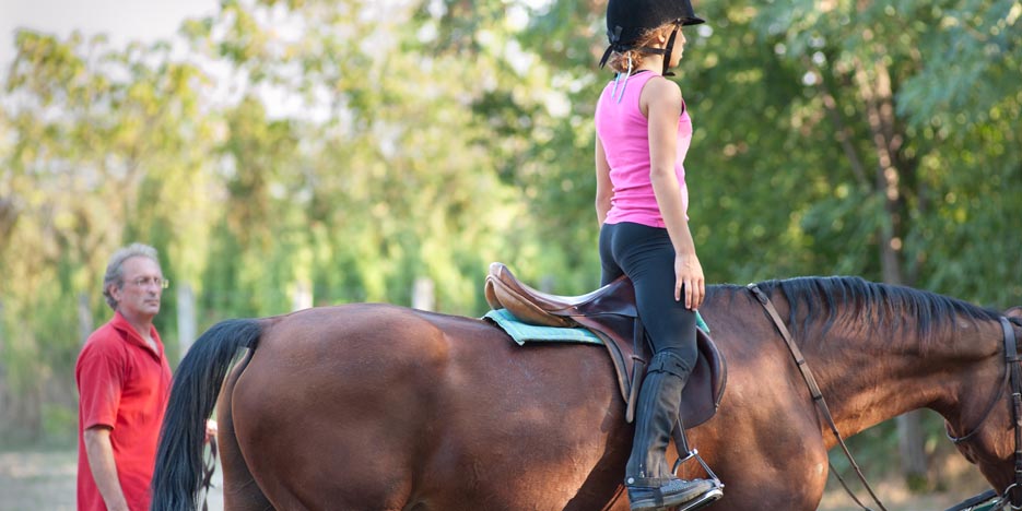 Girl riding a horse.